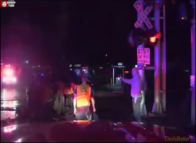 Video :Just before the train approaches, firefighters free a guy who is stuck on the rail